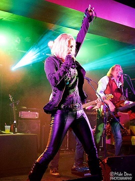 Photo of lead vocalist Shelley Faith performing onstage.